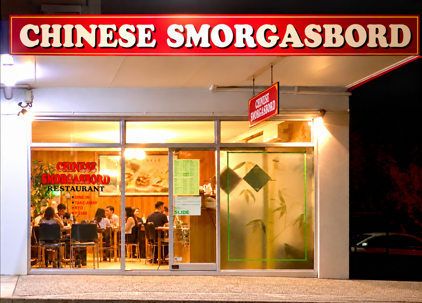 Chinese Smorgasbord restaurant shop front at night